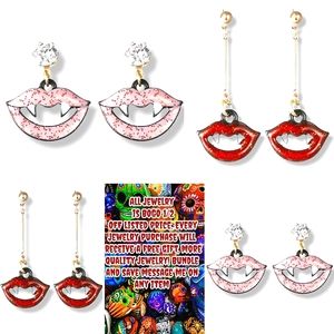 Bundle 2 pairs 1 red 1 pink sparkly crystal vampire teeth lips earrings
